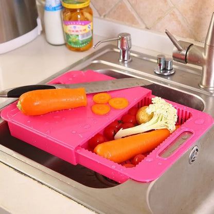 Blue multifunction kitchen chopping board with integrated sink drain basket and TPE handle.