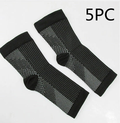 Anti-fatigue compression foot sleeve in black, red, or white, featuring moisture-wicking fabric and a heel hole for breathability.