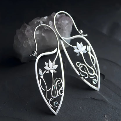 Silver lotus vine design women's earrings with geometric rhinestone details on electroplated alloy