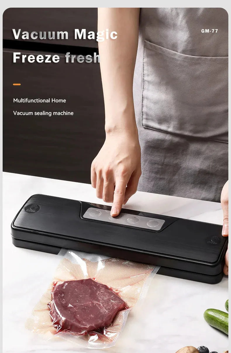 Black automatic vacuum sealer with 30cm sealing bar on kitchen counter next to vacuum-sealed food packages