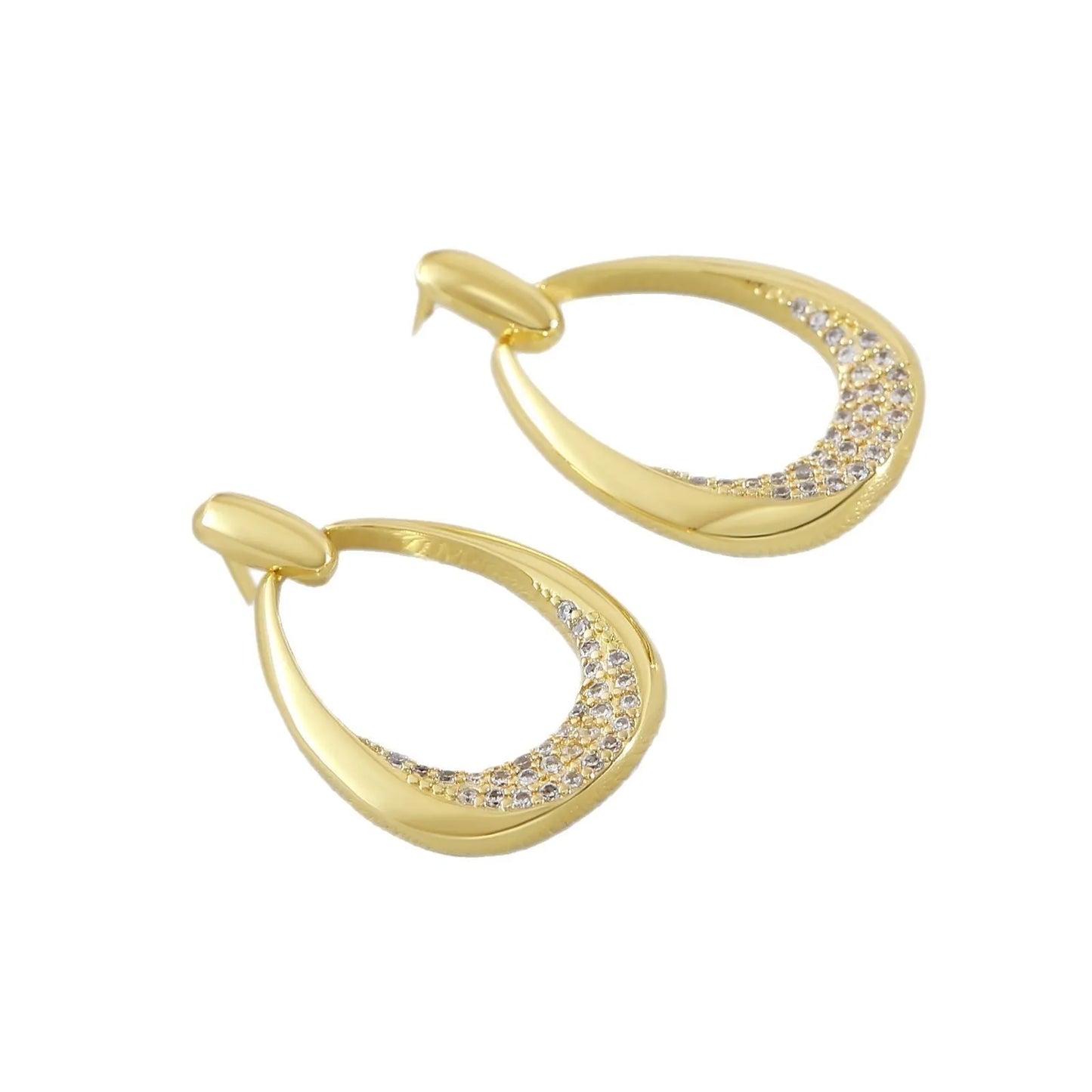 Women's yellow gold geometric drop earrings with oval and round elements on a white background.