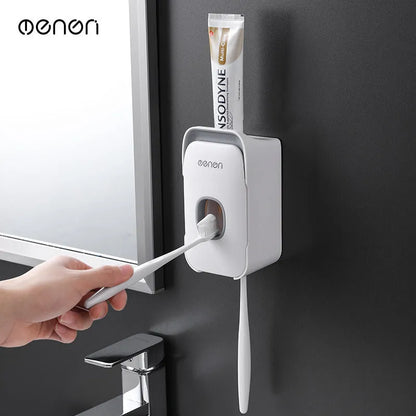 Automatic wall-mounted toothpaste dispenser in blue, grey, and pink colours with LED touch sensor.