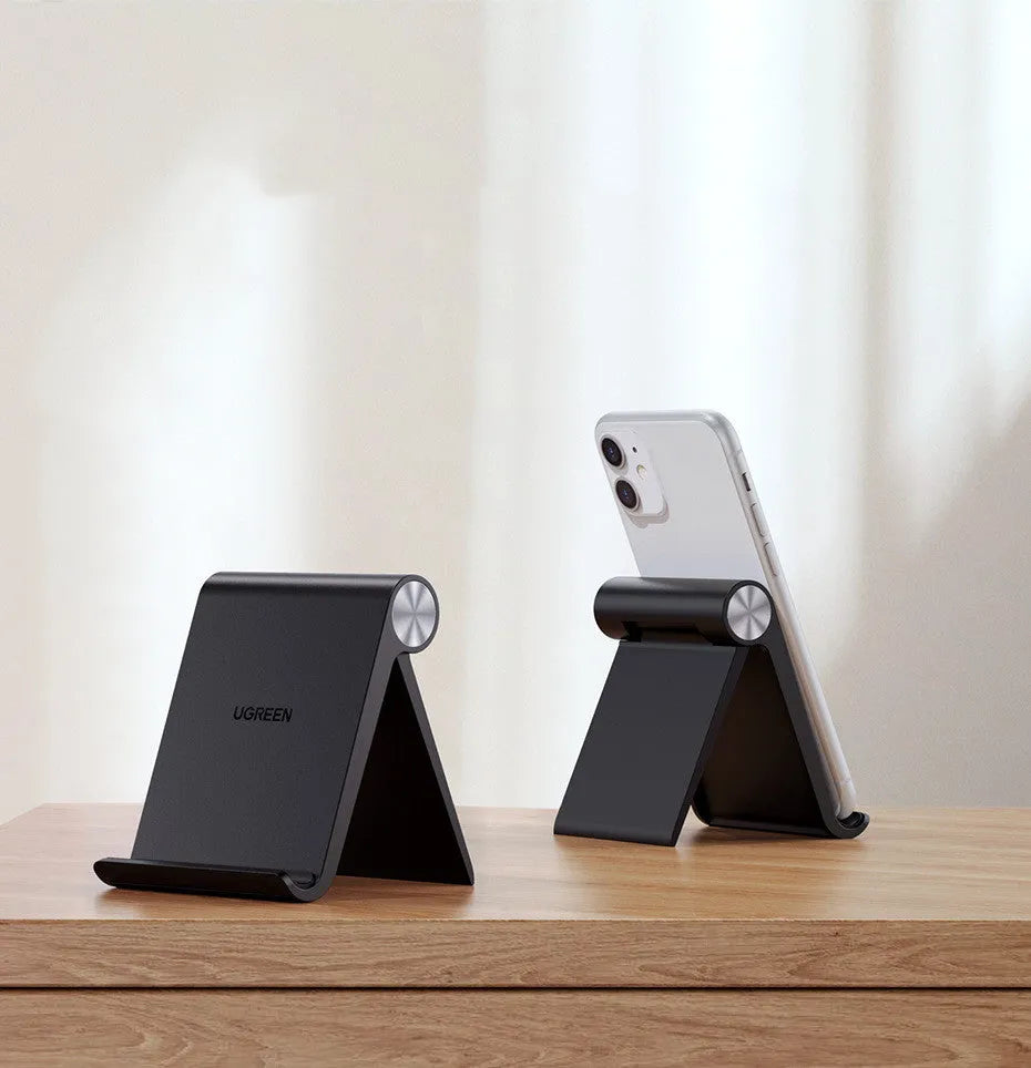 UGREEN LP106 adjustable lazy bracket phone holder in black, blue, or white, gripping a smartphone.