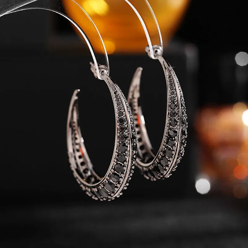 Women's geometric copper hoop earrings in gold white zirconium finish, showing 4.3 cm by 4.5 cm drop shape.