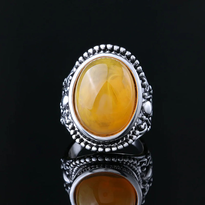 Retro geometric ring in fluorescent beeswax amber with antique silver alloy electroplating, available in UK ring sizes 7, 8, 9 and 10 for a distinctive statement piece