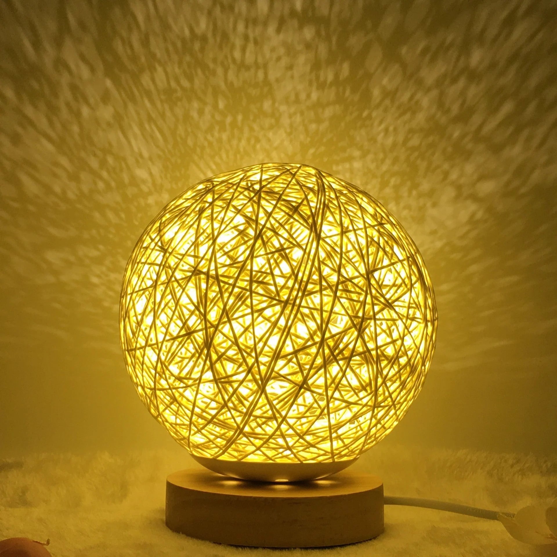 LED rattan table lamp with hand-knit linen shade in various colours