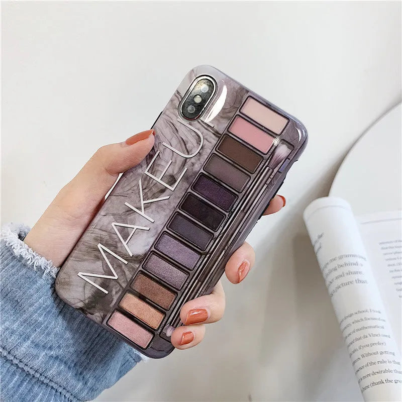 Silicone eye shadow phone case for iPhone showing flesh and grey colour options with precise port cutouts