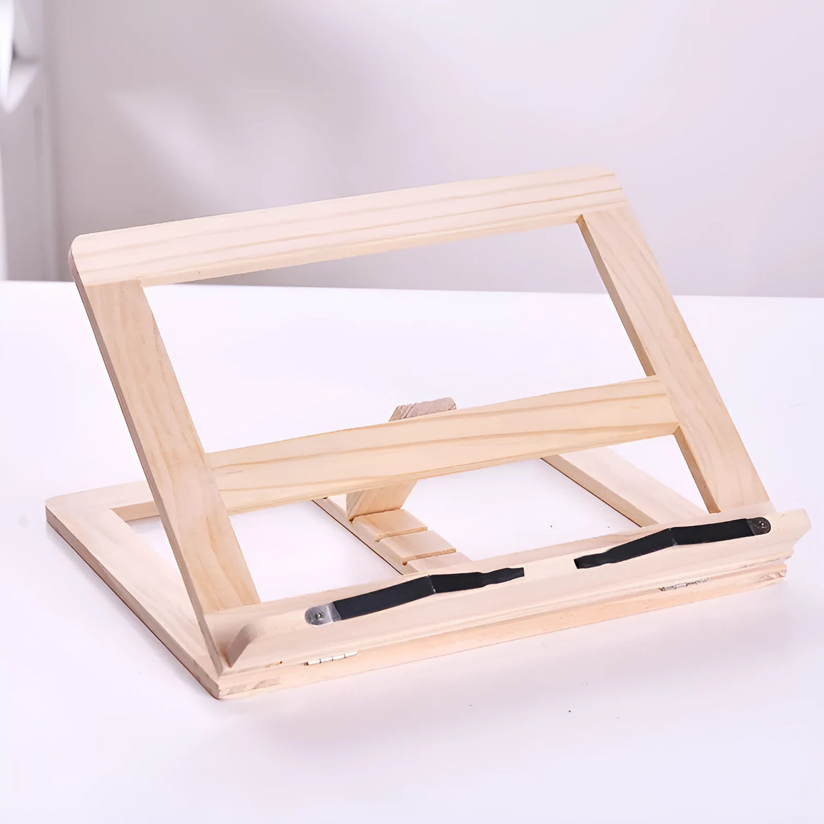 Large wooden reading book easel in pine with iron clamp, 31x24 cm, holding an open book on a desk