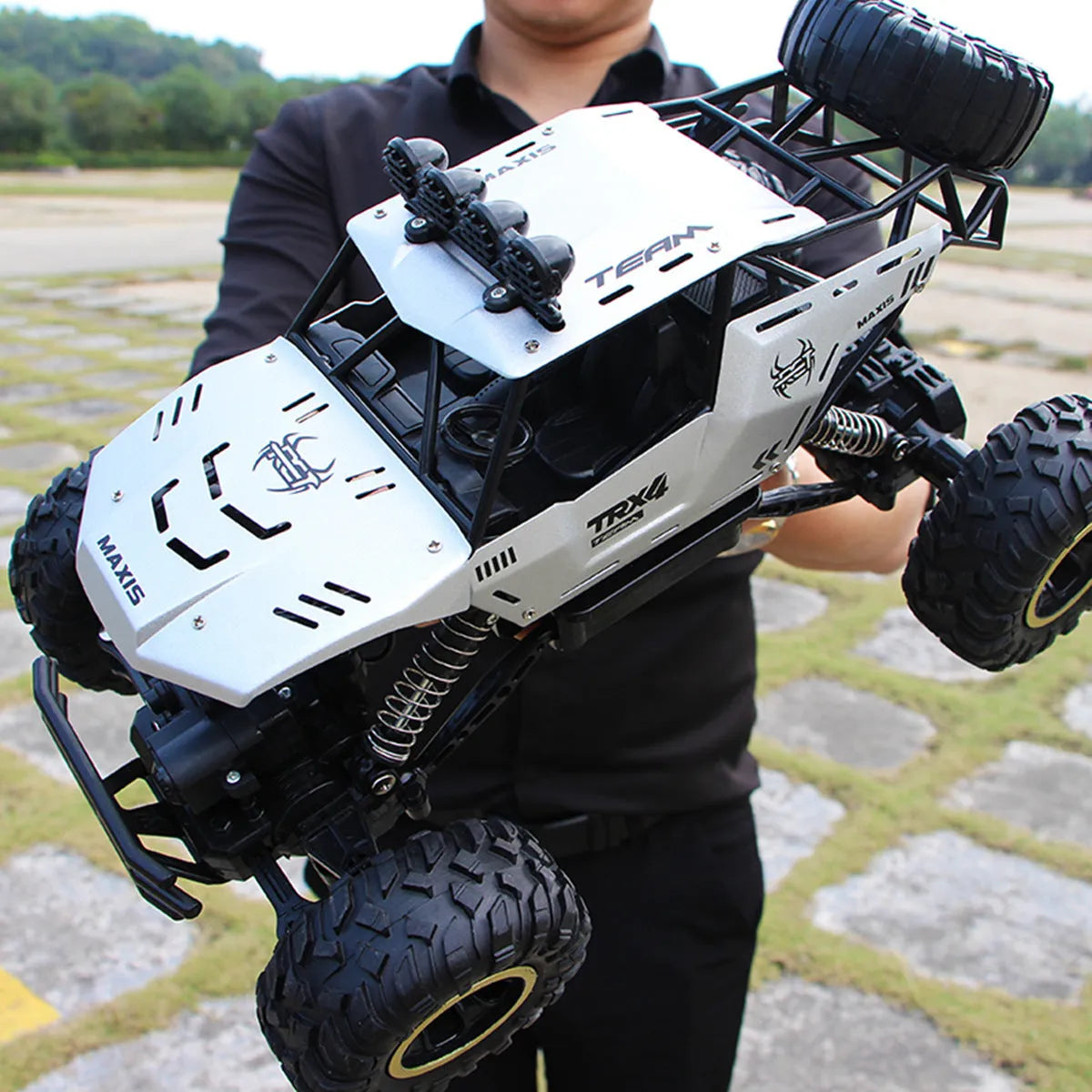 Four-wheel drive remote control car with 2.4G wireless controller on rough terrain