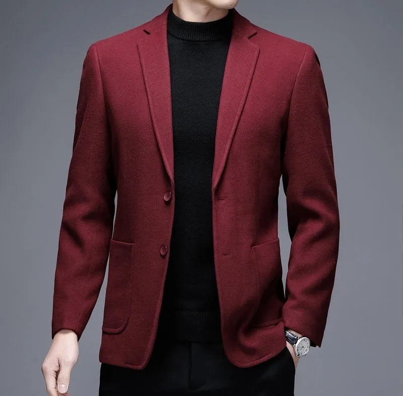 Man wearing a solid colour loose-fit suit-style winter jacket.