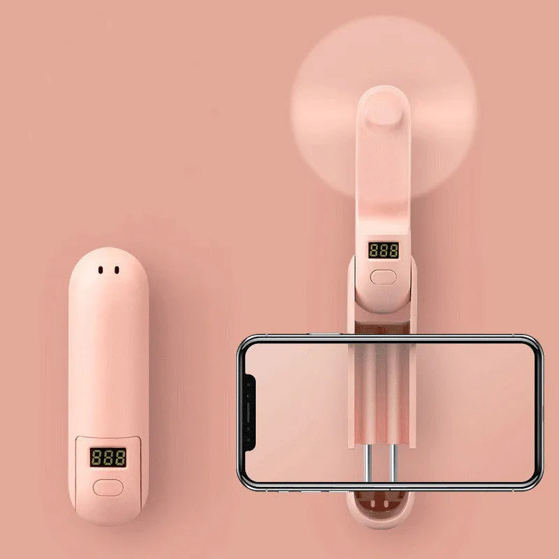 Folding mini fan in green, pink, or white with collapsible design and USB charging port