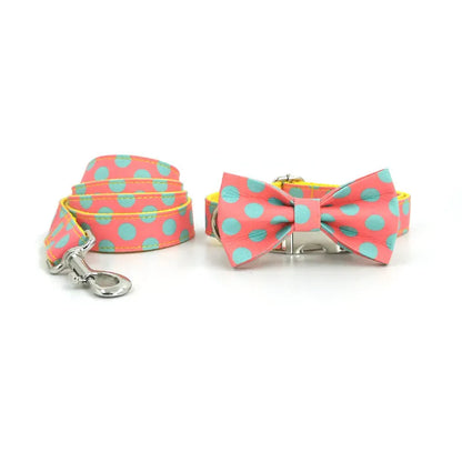 Yellow polka dot dog collar and lead set with coordinating bow, available in five sizes