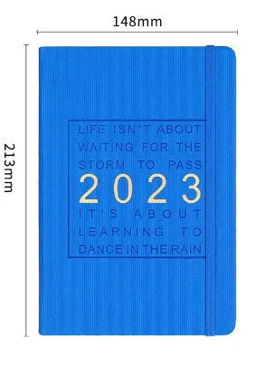 Creative student almanac calendar with imitation leather cover open to show weekly layout