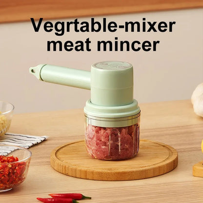 Green rechargeable electric hand mixer with whisk and beater attachments on a kitchen counter