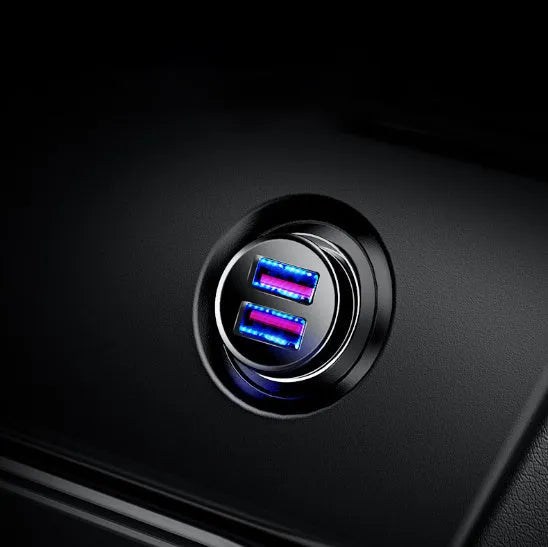 USB smart car charger with aluminium alloy casing in choice of colours, showing compact size for vehicle charging