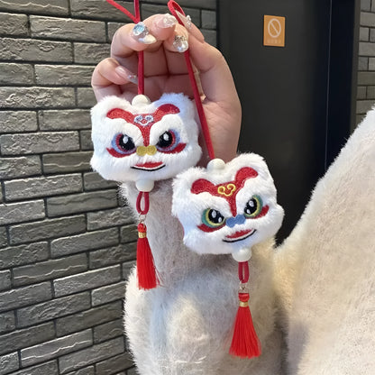 Handmade blue plush lion keychain with tassels and star stone decoration.