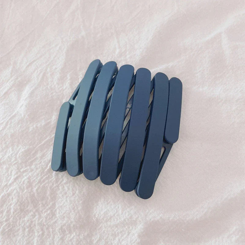 Compact retractable hair band with non-slip teeth grip, available in various colors for versatile styling