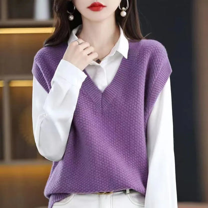 Women's creamy-white knitted sleeveless vest with 3D pattern, V-neck, worn as a layer over a shirt.