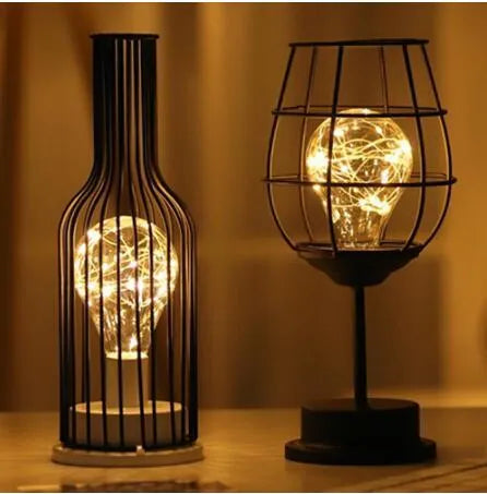 Minimalist wrought iron table lamp shaped like wine bottle with warm white LED light