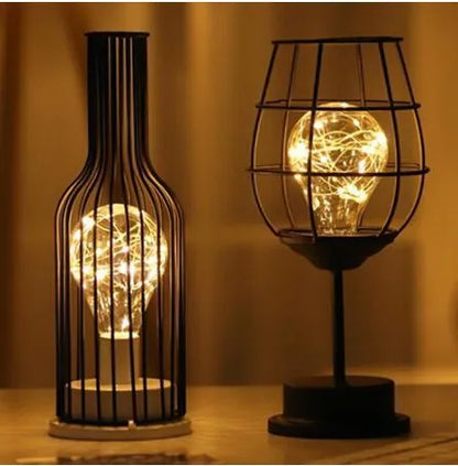 Minimalist wrought iron table lamp shaped like wine bottle with warm white LED light