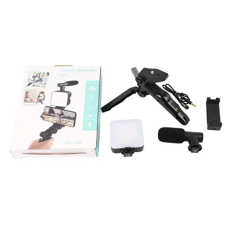 Square LED camera flash with universal hot shoe mount and rotatable head, shown with optional octopus stand tripod.