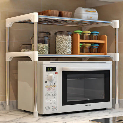 Silver and white microwave shelf rack with two tiers organising kitchen spices and essentials
