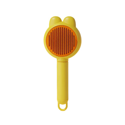 Green self-cleaning pet brush with release button and stainless steel comb for de-shedding cats and dogs.