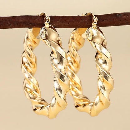 Geometric ring design ear clips for women with drop-shaped copper construction and electroplated finish