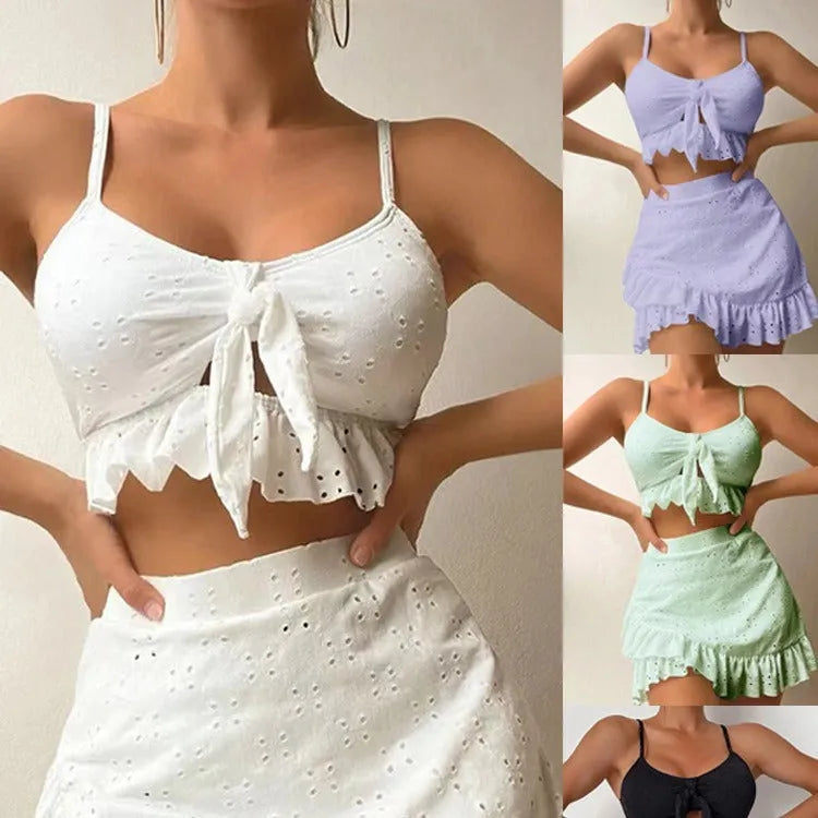 Women's swimsuit bikini three-piece set with split hip skirt in solid colours including white, black, and pink, designed for swimming and wading in sizes S, M, L, and XL with a polyester fabric lining.