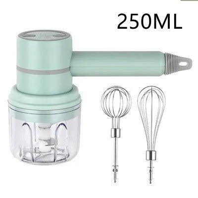 Green rechargeable electric hand mixer with whisk and beater attachments on a kitchen counter