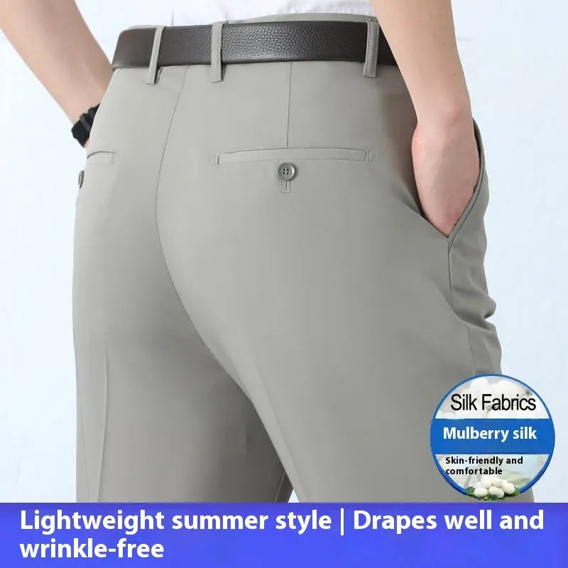 Man wearing dark blue straight-leg non-iron business trousers with a mulberry silk blend fabric.