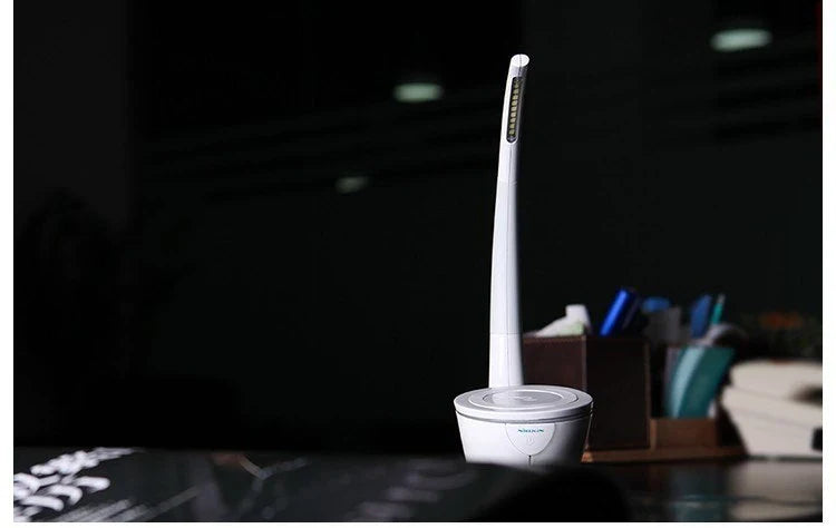 Stylish wireless charging table lamp with minimalist design, touch controls, and energy-efficient LED lighting