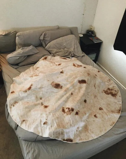 Round flannel burrito blanket with food-themed printing, showing coral fleece texture and wrap-style design