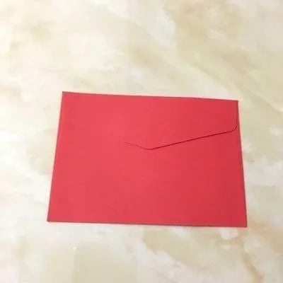 Mini coloured paper envelopes in various hues measuring 11.5 by 8 centimetres