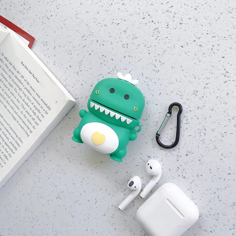 Green silicone AirPods case with raised cartoon animal design, showing charging port cutout.