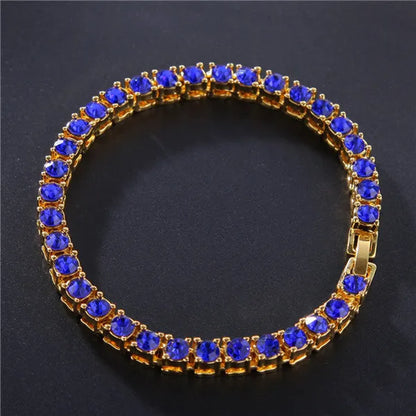 Men's silver alloy link bracelet with a row of clear rhinestones, shown on a wrist.