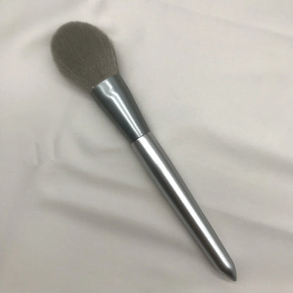 10 makeup brushes with moonlight silver finish and wooden handles beside PU brush bag