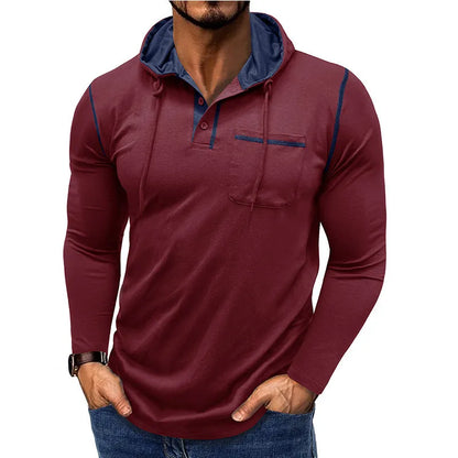 Man wearing a grey hooded henley long-sleeved t-shirt, showcasing the pullover style and cotton blend fabric.