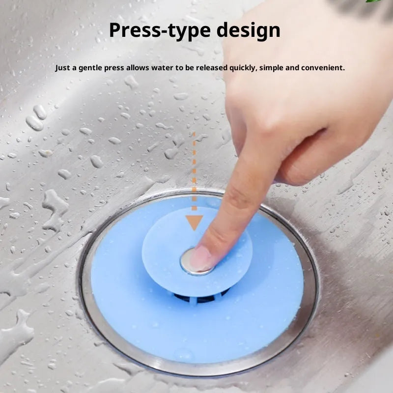 UFO-style silicone press sink drain cover in white, pink, gray, blue, and green