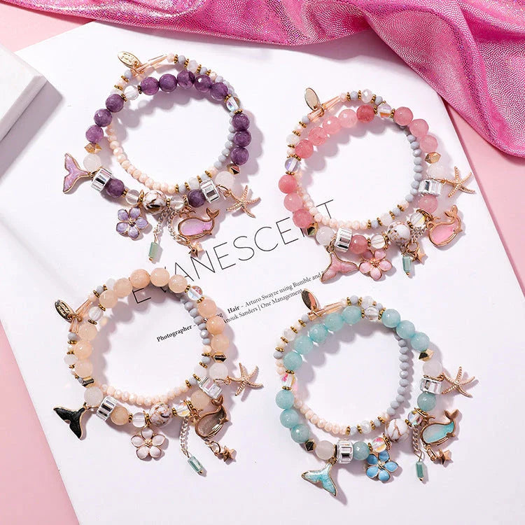 Whale tail bracelet with retro flower and starfish accents, a charming nautical accessory for UK fashionistas