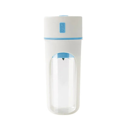 Blue portable USB rechargeable electric juicer blender with a large feed cap on a kitchen counter.