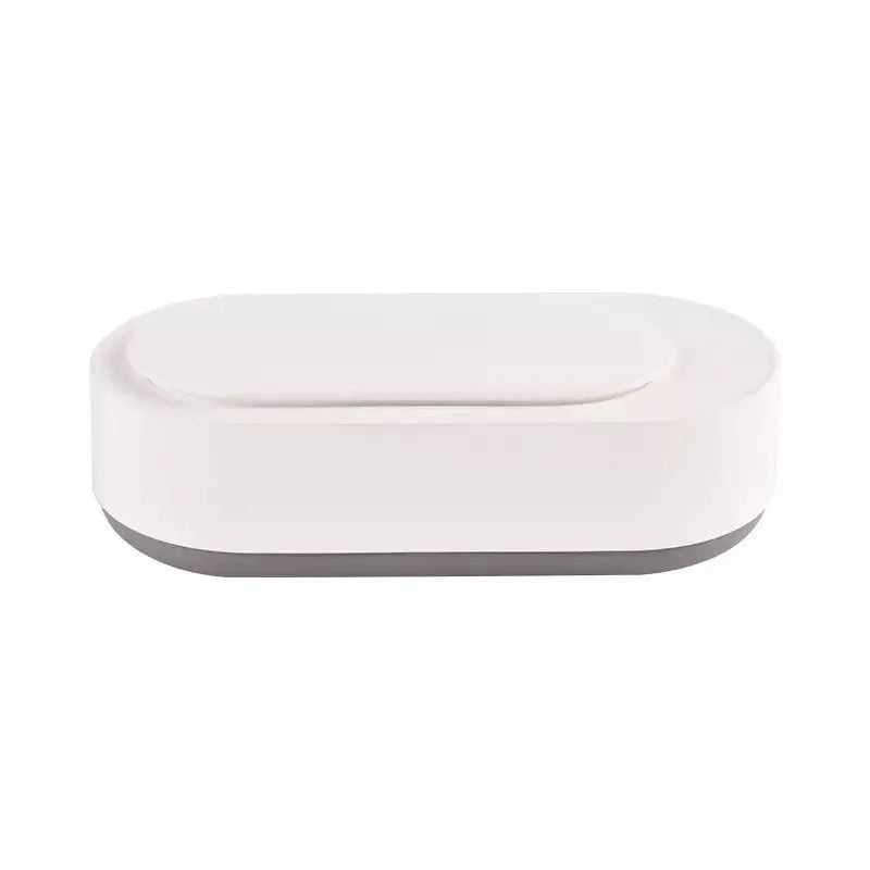 White portable ultrasonic cleaner with stainless steel tank for cleaning jewellery and glasses.