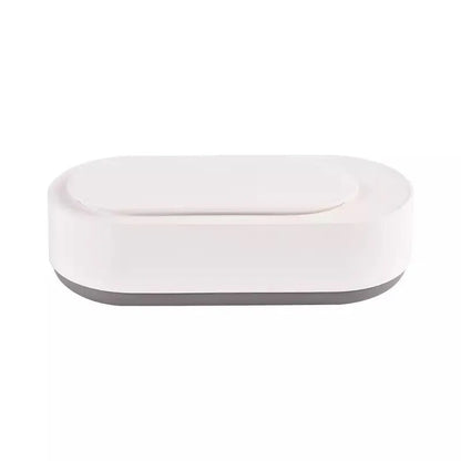 White portable ultrasonic cleaner with stainless steel tank for cleaning jewellery and glasses.