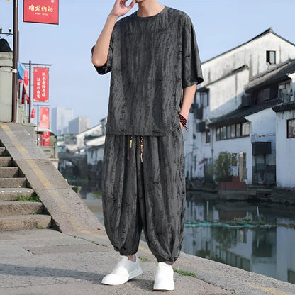 Men's thin knit two-piece suit with half-sleeve top and cropped trousers in black or grey colour options