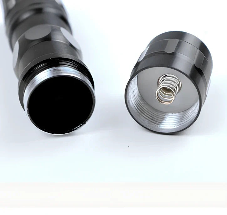 Black aluminium LED mini flashlight measuring 9.5cm with 3W bulb and AA battery compartment