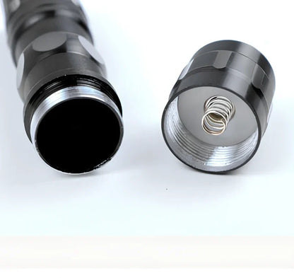 Black aluminium LED mini flashlight measuring 9.5cm with 3W bulb and AA battery compartment
