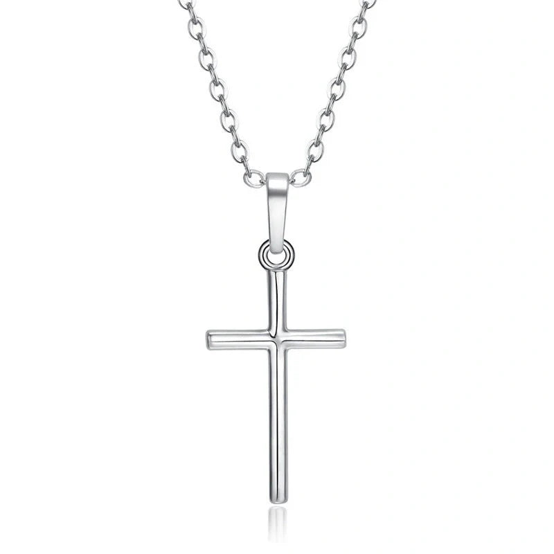 Elegant cross pendant necklace in gold and silver tones, a timeless British accessory