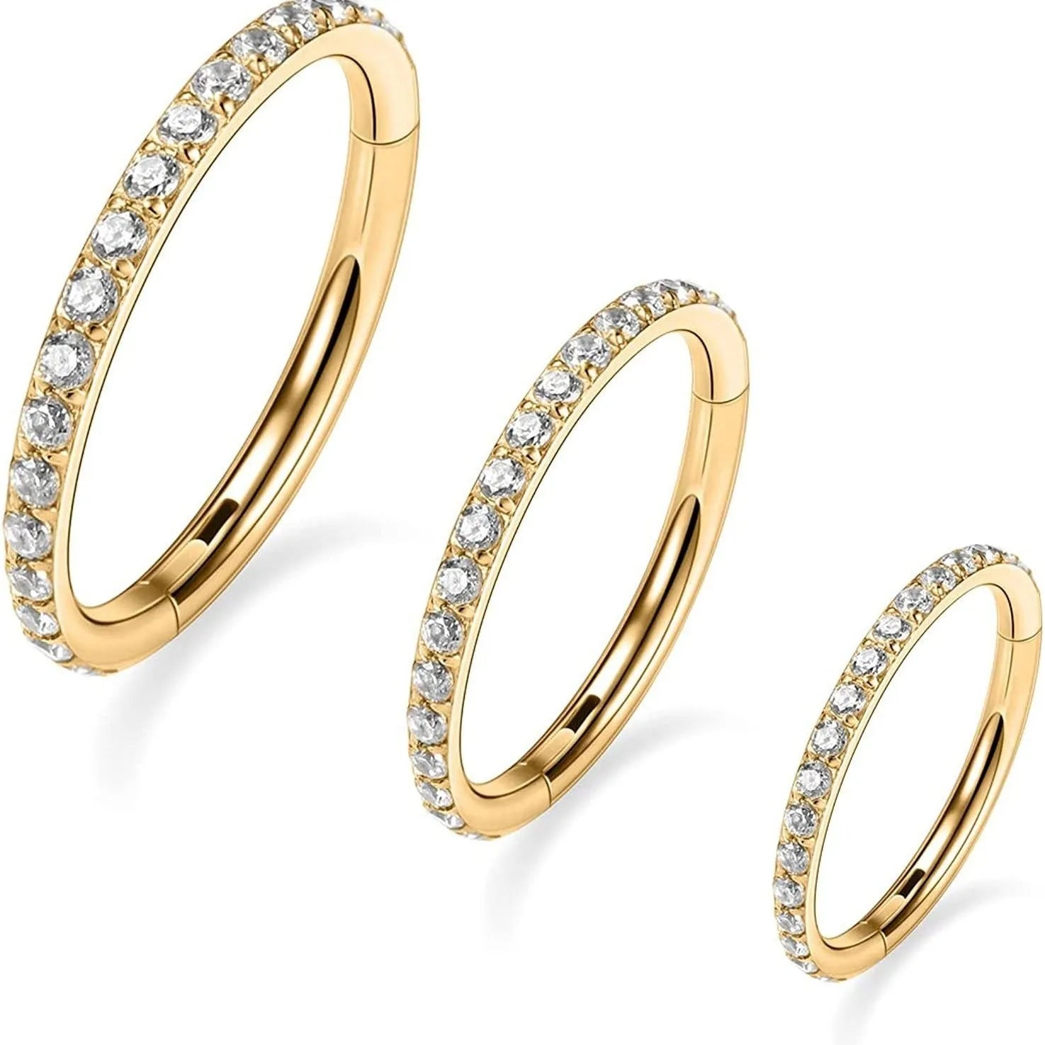 A seamless round hoop nose ring in stainless steel, shown alongside gold and rose gold colour options.