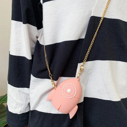 Pink silicone protective cover on an AirPods charging case.