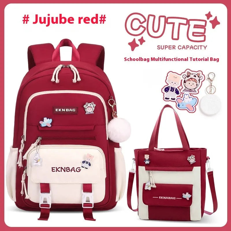 Pink girls school backpack with curved shoulder straps on a wooden floor